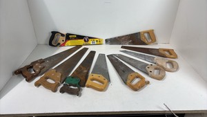 Lot of various hand saws and miter box