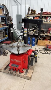 Mayflower Red Tire Changer with a bead blaster.