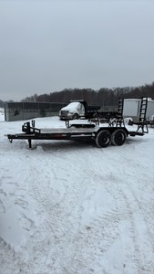 2002 PJ Flatbed equipment trailer with two loa with two loading ramps. 18x7