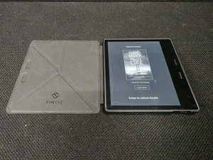 Amazon Kindle Oasis e-reader with a Fintie Origami case