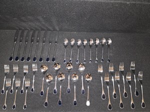 Vintage Frst Besteck Flatware (Silverware) set in the Happy Day pattern, featuring unique dark, rounded handles.