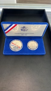 1986 90% Silver Dollar and clad half dollar commemorative set