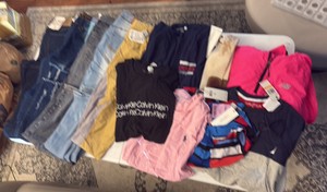 (4) PAIRS of jeans, leggings, (3) Calvin Klein shirts, Nautica shirt, and new balance wind breaker