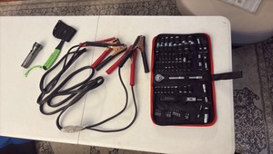 SOCKET set, jumper cables, axe, and flash light