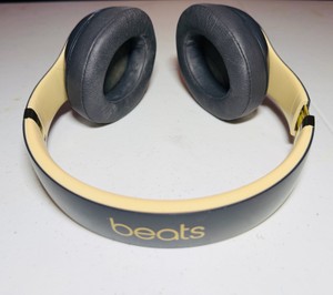 BEATS Wireless Studio3 Noise Cancelling headphones grey & tan in color.