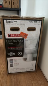 DELTA Foundations 2-piece elongated white toilet