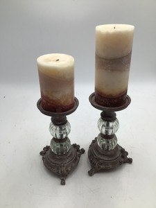 2 pillar candle holders with candles
