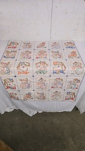 Vintage Baby Quilt with cross stitching animals.