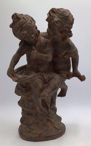 19th-century Renaissance-style terracotta sculpture depicting two huddled cherubs