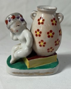 Occupied Japan Porcelain Figurine  Cherub Leaning on Vase with Flowers
