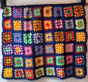 Vintage Crocheted Granny Square Afghan  Multicolor Floral Motifs on Navy Ground