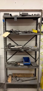 Metal 5-shelf unit with contents.