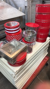 assorted Christmas tins and pails