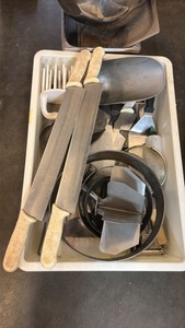 Bucket of various tools scoops