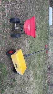 two spreaders one manual one with hitch
