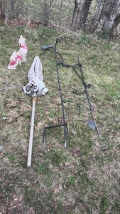 lot of outdoor decorations, including an umbrella, howling, dog statues, and wind catchers