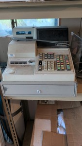 Cash registrar and paper for it