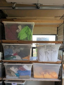 five bins of shirts and more