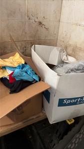lot of Port Authority button up shirts in various sizes and various color T-shirts