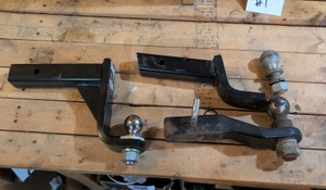 Lot of trailer hitches and balls