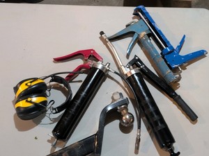 Grease gun ear protection, caulk gun and trailer hitch