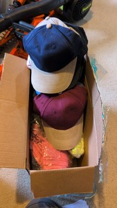 box of hats that are still tagged