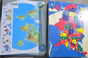 Large box of wooden and laminated maps
