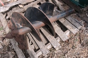 Standard earth Auger bit with 6 teeth approximately 9 to 12 dia.