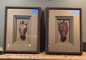 Giraffe and Zebra Masks in framed shadow boxes