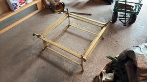Brass Table with scroll finials and Glass Top.