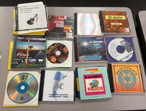 lot of CDs, English and Spanish (R214)
