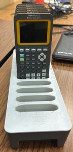 T1 84 Texas instrument calculators six missing the charger for the charging station  (r210)