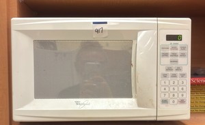 Whirlpool Microwave and books (R132)