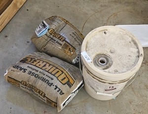 bucket of sand with two bags (r137)