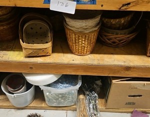 two shelves of baskets and decorative rocks (r137.5)