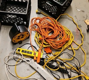 crate of extension cords and extension Outlets (r137.5)