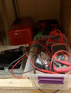 shelf of multimeter light switches nails in tote of leather materials (r137.5)