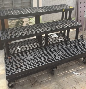 Greenhouse plant display on wheels