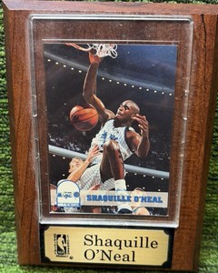 Shaq plaque. SHAQUILLE ONEAL ROOKIE CARD, mounted onto wood, and under plastic.