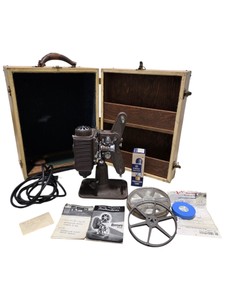 Estimated value $200-$300 Vintage Revere Eight 8mm Projector Model 85 With Case, Reels, Manuals & GE Projection Lamp