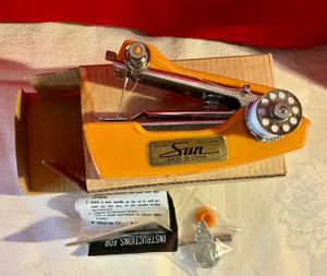 Vintage small hand held sun sewing machine in original box