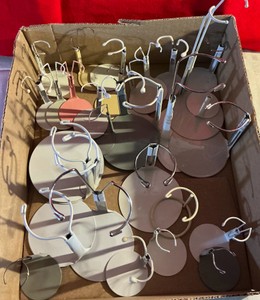 Large group of metal doll stands