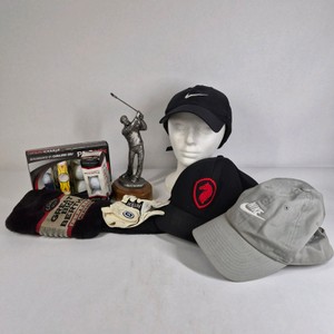 Lot of Nike Hats, Golf Balls, Gloves, Towel, and Golfer Trophy