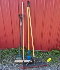 Lot of Assorted Brooms, Shovel, and Long Handle Yard Tools
