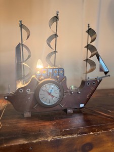 Vintage United Clock Corp Ship Clock & Lamp featuring a wooden body and metal sails.