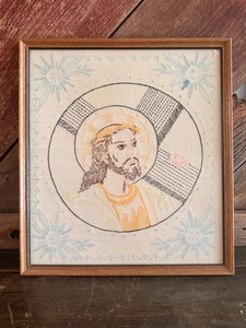 Vintage framed needlepoint embroidery depicting a portrait of Jesus Christ.