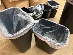 Assortment of 7 Black Plastic Garbage Cans, Each Garbage Can Comes With Several Clear Plastic Garbage Bags Already Loaded in the Bottom, Different Sizes and Shapes, One With a Lid