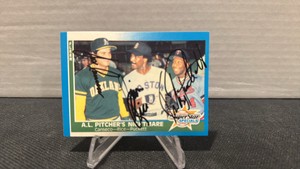1987 fleer Autographed baseball card Kirby Puckett, Jose Canseco and Jim Rice