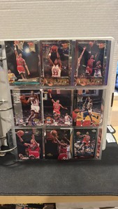 A collectors album full of basketball cards, inserts, Hall of Famers and rookies