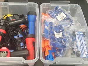 2 totes of miscellaneous items and flashlights